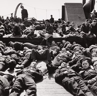 Lot 12 - ROBERT CAPA (1913–1954)  | US-troops a few hours before landing, Italy 1943