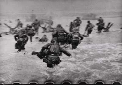 Lot 13 - ROBERT CAPA (1913–1954) | US-troops landing on Omaha Beach in the Normandy at D-Day, France 1944