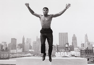 Lot 47 - THOMAS HOEPKER (1936–2024) | Muhammad Ali at a bridge over Chicago River, USA 1966