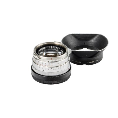 Lot 37 - Leitz Summilux 1.4/35mm Chrome + OLLUX